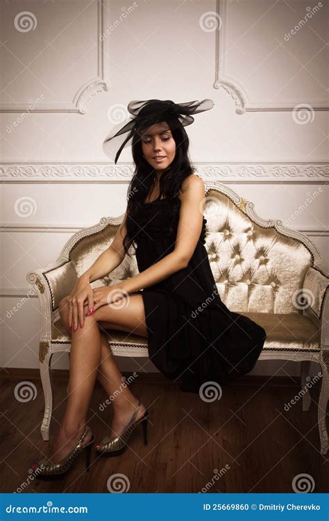 Attractive Brunette Sitting On The Couch Stock Photo Image Of Lady Beauty 25669860