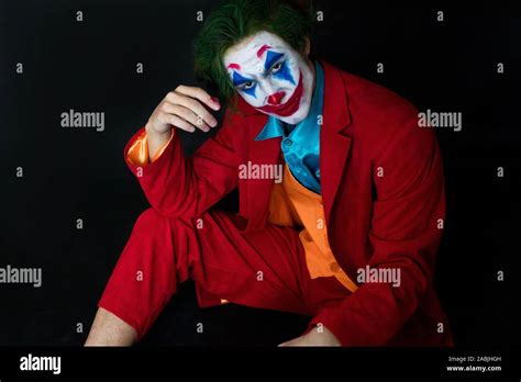 Man Impersonating The Joker Portrait Of A Man In A Suit With Clown