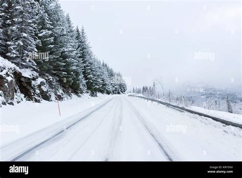 A snow covered road in Norway Stock Photo - Alamy