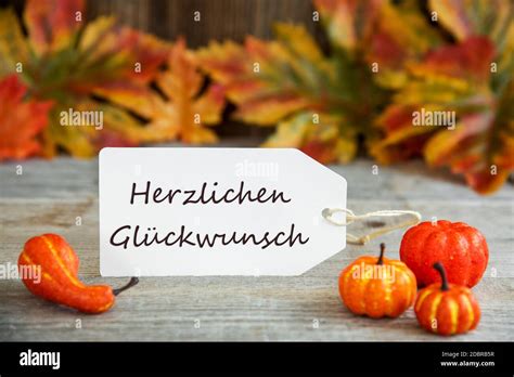 white label  german text herzlichen glueckwunsch means congratulations wooden background