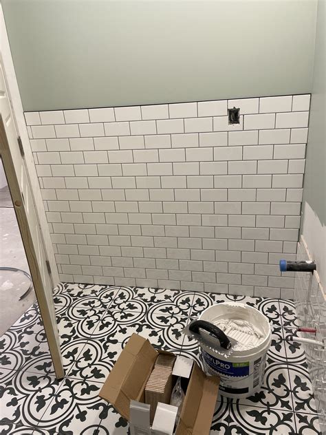 white tile with black grout flooring 6