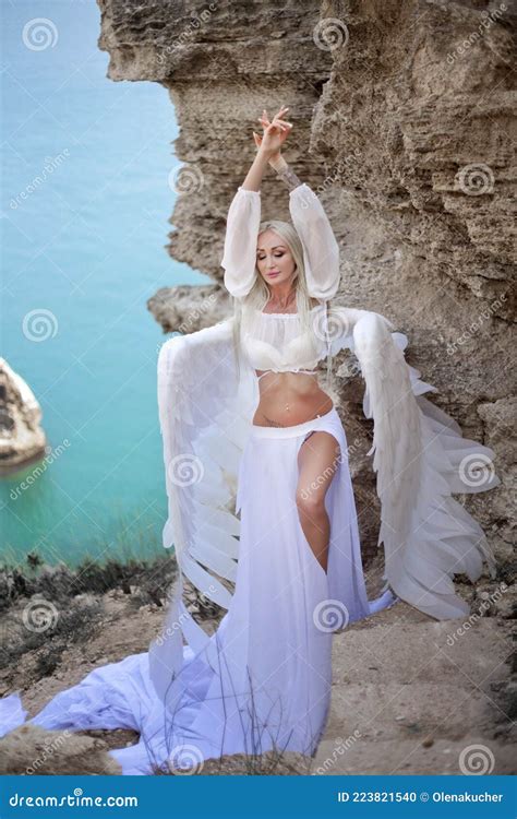 Blonde Like A Doll In The Bathroom On A Gold Background In Gold Dress Stock Photo Image Of