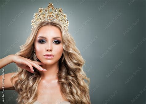 Glamorous Blonde Woman With Golden Crown Makeup And Wavy Hair Cute Fashion Model With Diamonds