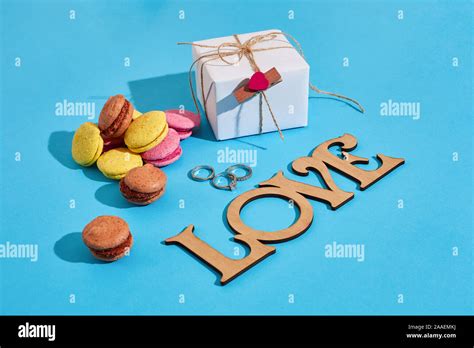 Macaroons and gift box on a blue background with the words I lov Stock ...