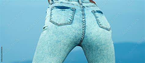 Pretty Women S Ass In Tight Jeans On Blue Background Fit Female Butt In Jeans Young Sexy