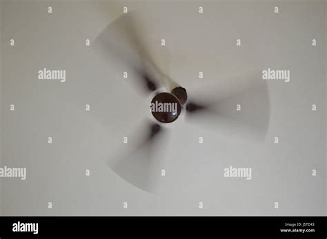 rotating ceiling fan captured       illustrates