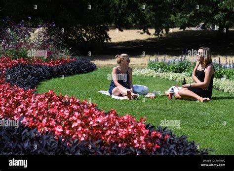 People Enjoy The Sunshine In Hyde Park In London As The Hot Weather Continues Across The