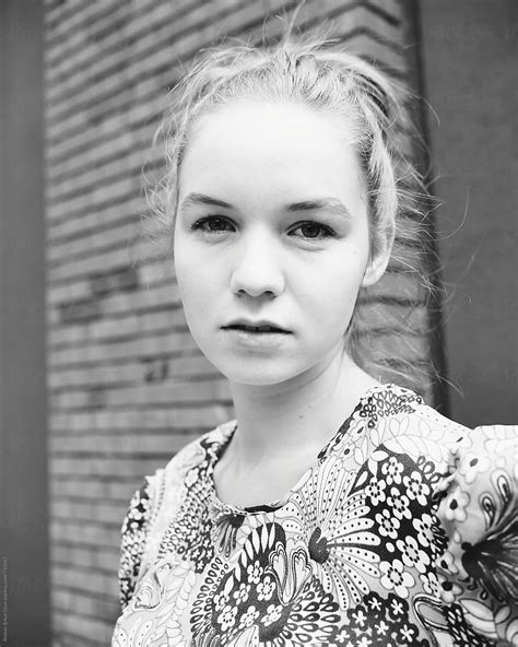 Blonde Girl Posing Against Brick Walls By Stocksy Contributor Atakan Erkut Uzun Stocksy