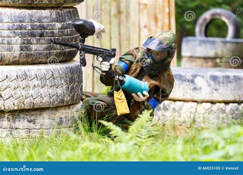 Young Woman Shooting from Paintball Gun Stock Image - Image of ...