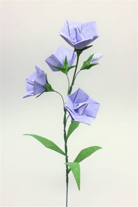 Three Purple Origami Flowers In A Vase