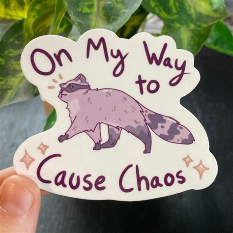 OMW To Cause Chaos Raccoon Sticker – Feather Fawn Studio