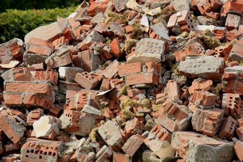 Pile Of Broken Red Bricks On Construction Site Photo Background And