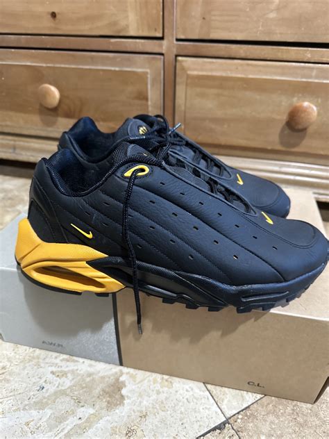 Nocta X Nike Hot Step Air Terra Black University Gold Gem