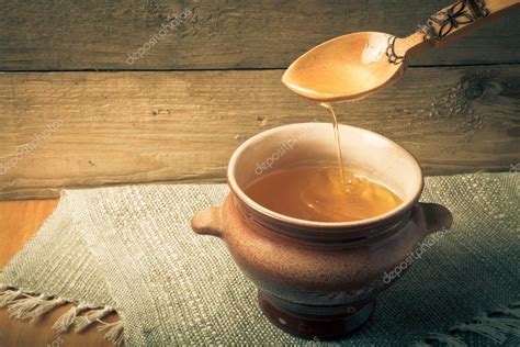 Clay Pot With Ghee And Spoon On Linen Napkin Rustic Still Life Stock