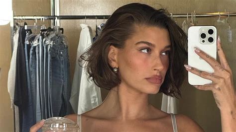 Hailey Bieber Shows Off Her Cleavage And Toned Abs As She Snaps A Selfie In Lacy White Lingerie