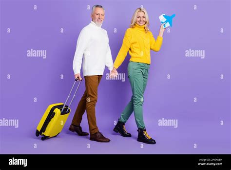 Photo Of Funny Excited Mature Wife Husband Wear Knitted Pullovers Smiling Checking In Plane
