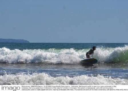 Indonesia Bali Travel A Surfer Is Seen On A Wave At Uluwatu In Bali