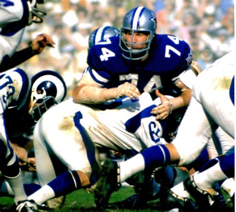 All-Pro and Hall of Fame defensive tackle Bob Lilly battles against the ...