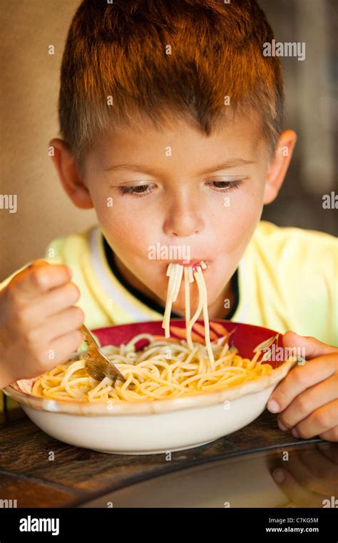 Boy Eating Spaghetti Stock Photo Alamy
