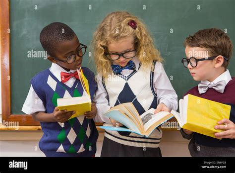 Pupils reading books Stock Photo - Alamy