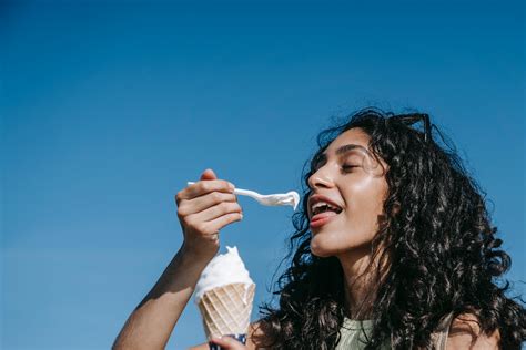 A Woman Eating Ice Cream · Free Stock Photo