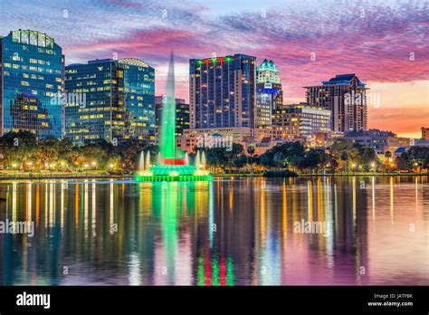 Orlando skyline sunset lake eola hi-res stock photography and images ...