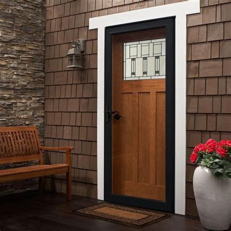 A Wooden Bench Sitting Next To A Brown Door