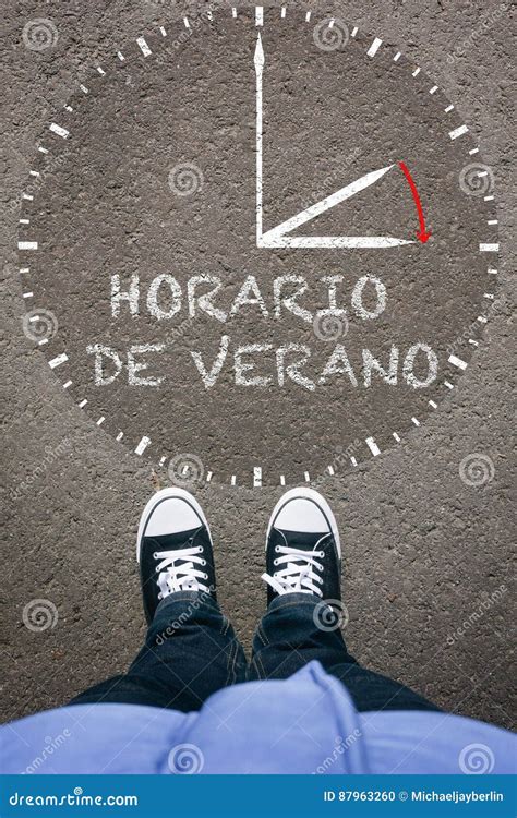 Horario De Verano, Spanish Daylight Saving Time on Asphalt with Stock ...