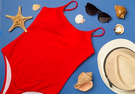 Premium Photo Beautiful Red Bikini And Accessories On Color Background Top View