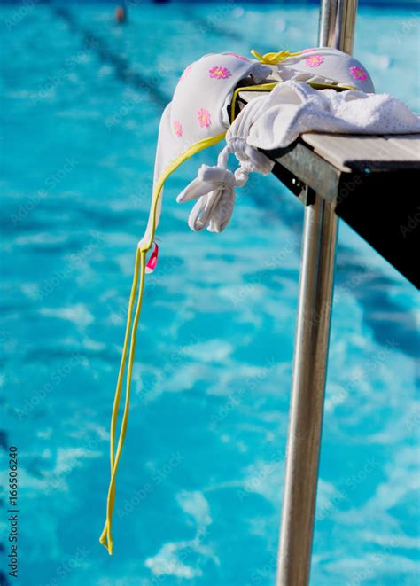 Foto De White Bikini Dries On Step Of Lifeguard Chair By Pool Do Stock Adobe Stock
