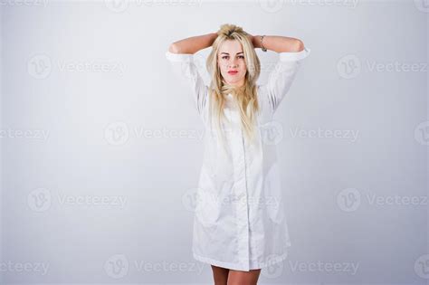 Attractive Blonde Female Doctor Or Nurse In Lab Coat Isolated On White Background 10489485