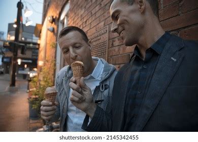 Male Gay Couple Sharing Ice Cream Stock Photo 2145342455 Shutterstock