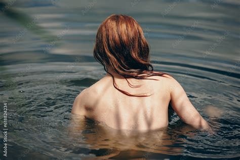 Back Of Of Naked Woman Swimming In A Lake Stock Photo Adobe Stock