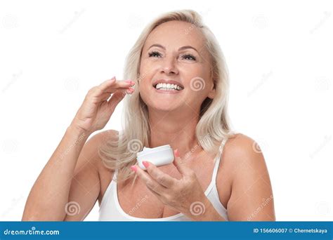 Portrait Of Mature Woman With Perfect Skin Holding Jar Of Cream On White Background Stock Image