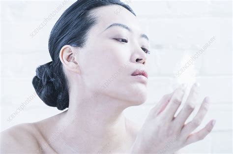 Nude Woman Examining Feather Stock Image F019 0312 Science Photo