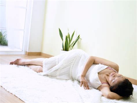Premium Photo Mature Woman Lying On Fur Rug At Home