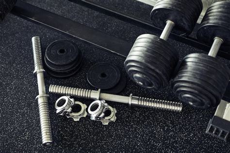Premium Photo | Dumbbells for training in gym