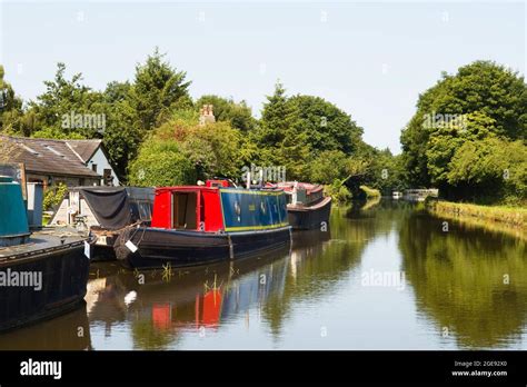 Moored Narrowboats On The Leeds Liverpool Canal Looking Towards