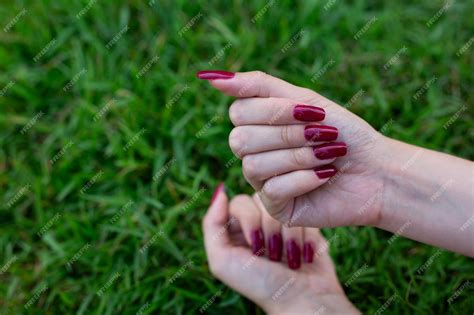 Premium Photo Girls Hands Showing Long Fingernails With A New Red