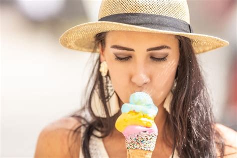 Premium Photo Beautiful Happy Woman Licks Ice Cream During A Hot Summer Day