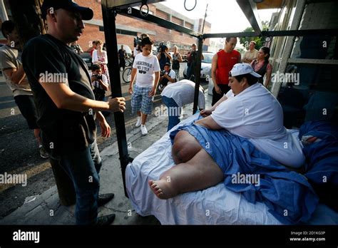 Manuel Uribe waits for a forklift outside his home in the suburb of San ...
