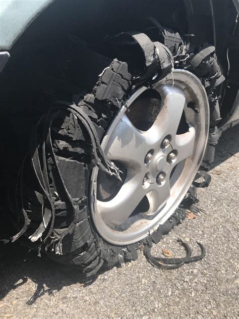 Car Tire After Running Over A Spike Strip R Mildlyinteresting