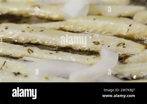 Frying Potato Strips Into A Hot Pan With Onion Seasoning And Oilin Close Up French Fries