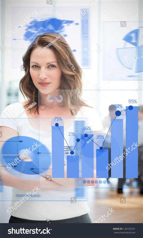 Confident Blonde Businesswoman Using Chart Interfaces Stock Photo