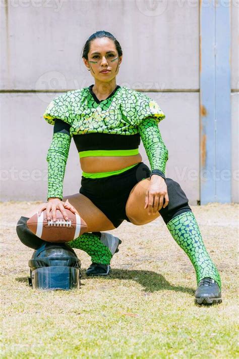 Portrait of mexican woman american football player wearing uniform with ...