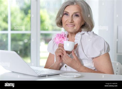 Mature Woman Portrait Using Laptop Stock Photo Alamy