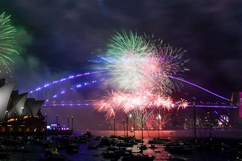 Download Celebrating New Years With Fireworks And City Skyline