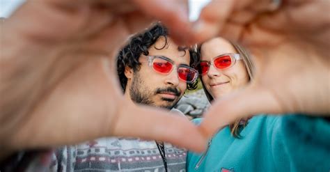 A Couple Forming a Heart Shape with Their Hands · Free Stock Photo