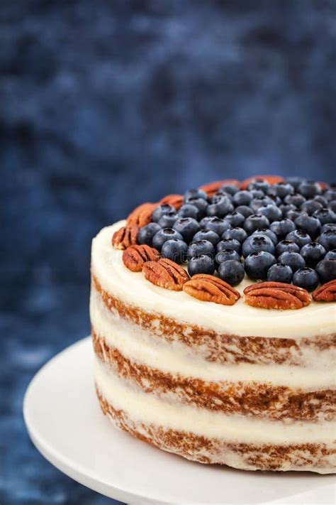 Naked Carrot Cake Decorated With Fresh Blueberry And Pecan Stock Photo