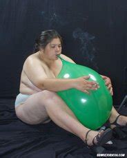 Pretty Bbw Chick Naked And Smoking While Sitting On Balloons Photos